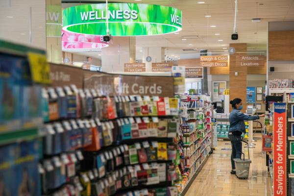 A woman shops inside of a Rite Aid store underneath a DeepCam security camera in New York City, New York