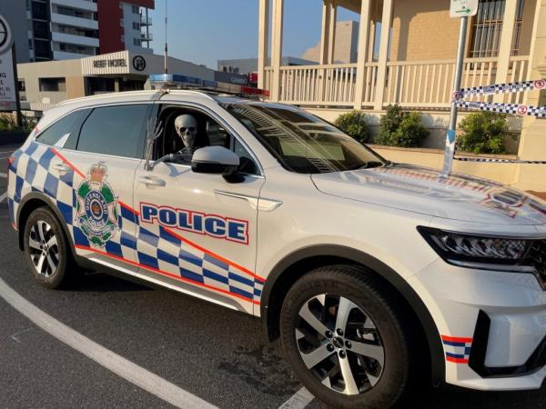 skeleton in a police car