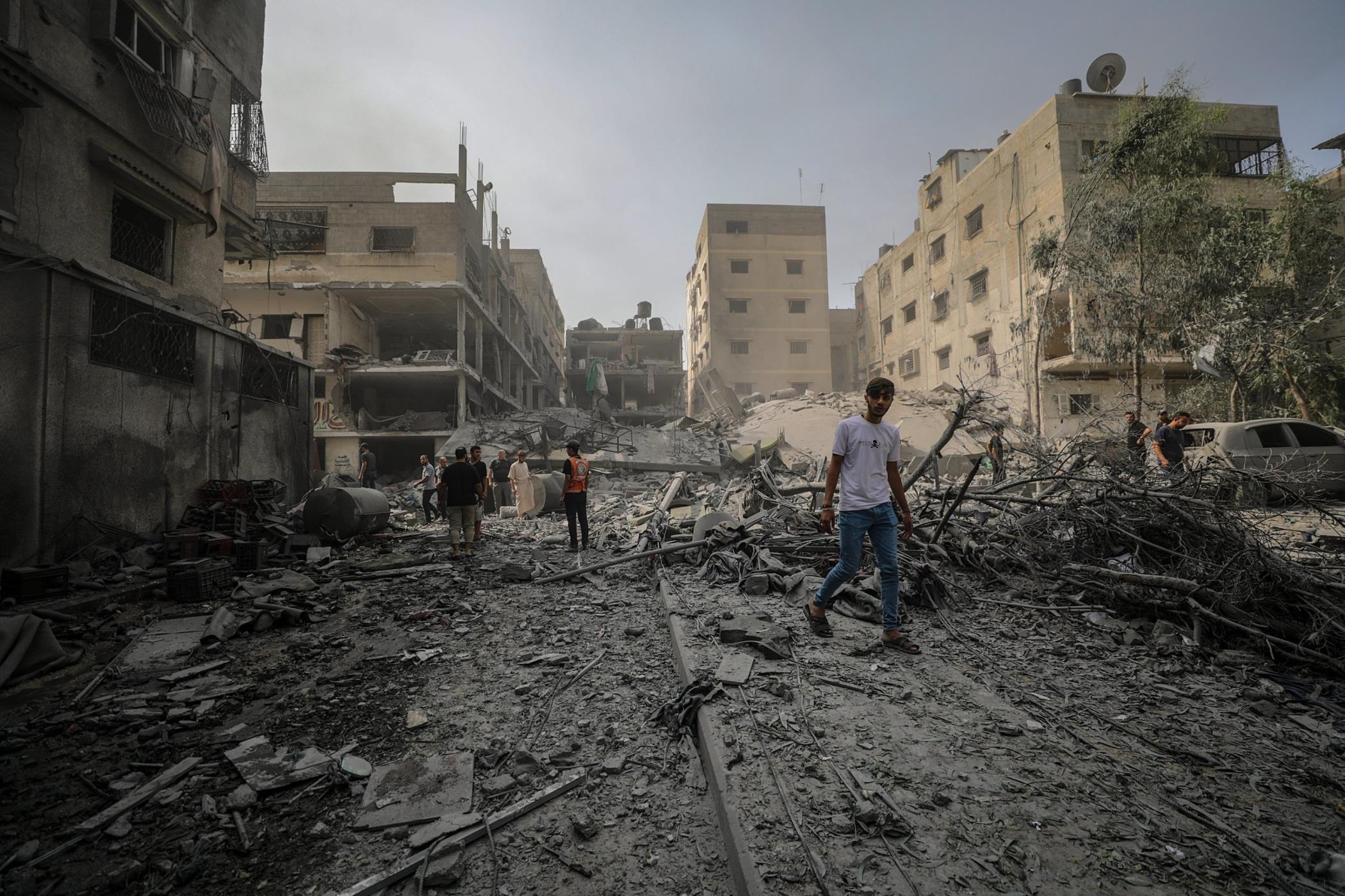 Palestinians inspect a destroyed area after Israeli airstrikes in Gaza City, Palestine, Oct. 23, 2023. (EPA Photo)