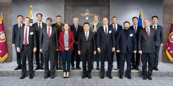 South Korean Defense Minister Shin Won-sik (C, first row) and the representatives of eight member states of the North Atlantic Treaty Organization pose for a photo after their meeting at the defense ministry building in Seoul on Dec. 13, 2023, in this photo provided by Shin's office. (PHOTO NOT FOR SALE) (Yonhap)