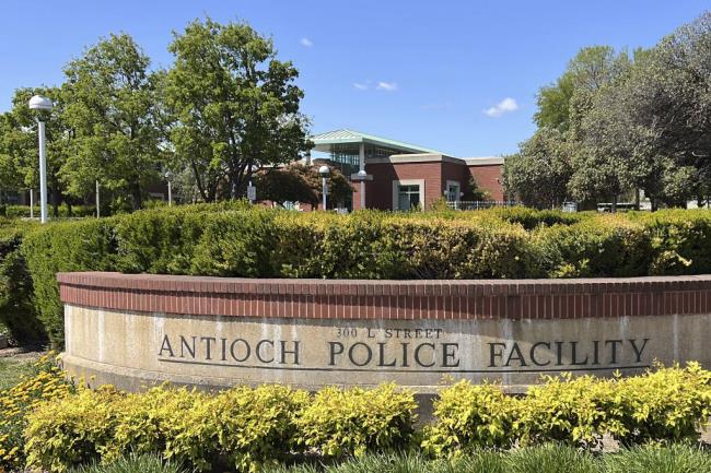 FILE - A sign marks the exterior of the Antioch police headquarters in Antioch, Calif., on April 19, 2023. Racist police text messages co<em></em>ntaining slurs and images of gorillas will take center stage in a San Francisco Bay Area courtroom on Friday, July 21, 2023, as a judge weighs whether the messages violated a state law designed to stamp out racism in the criminal court system. (AP Photo/Terry Chea, File)