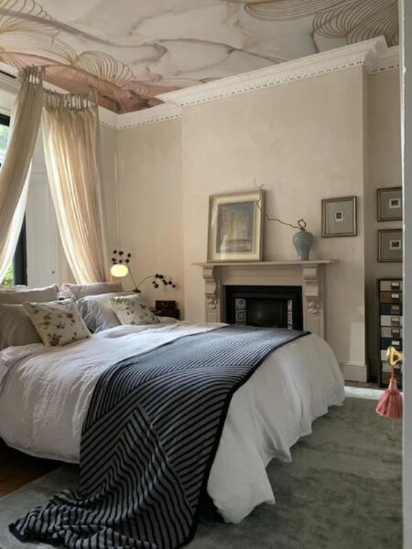  A calm colour palette features in the bedroom in a downstairs reception room.