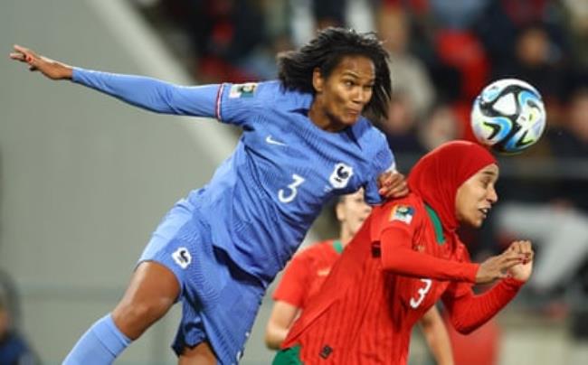 Morocco's Nouhaila Benzina feels the full force of Wendie Renard’s defensive capabilities.