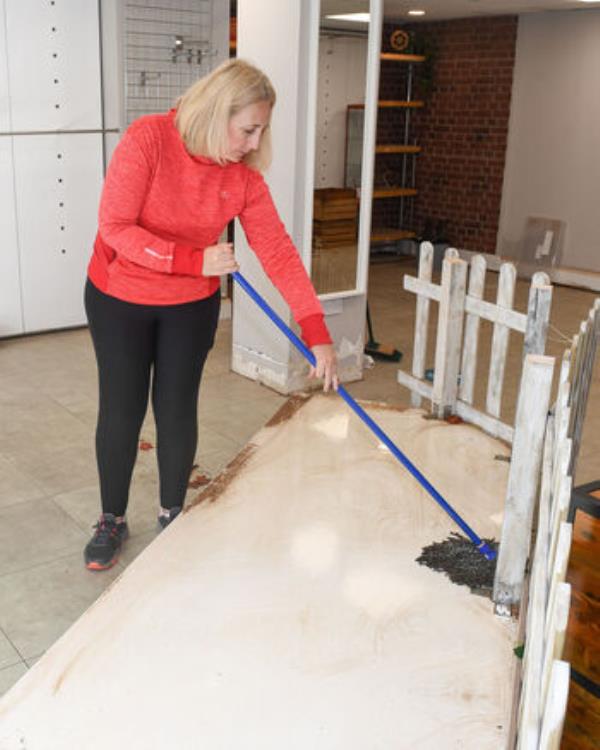  Laragh O'Brien of Fox & Co Menswear during the clean-up operation as a result of the flooding in Midleton Co Cork. Picture: David Keane.