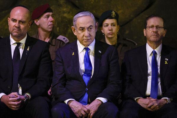 Israeli Prime Minister Benjamin Netanyahu, center, and President Isaac Herzog, right, attend a wreath-laying ceremony marking Holocaust Remembrance Day in the Hall of Remembrance at Yad Vashem, the World Holocaust Remembrance Centre, in Jerusalem, Israel. Picture: Amir Cohen/Pool Photo via AP