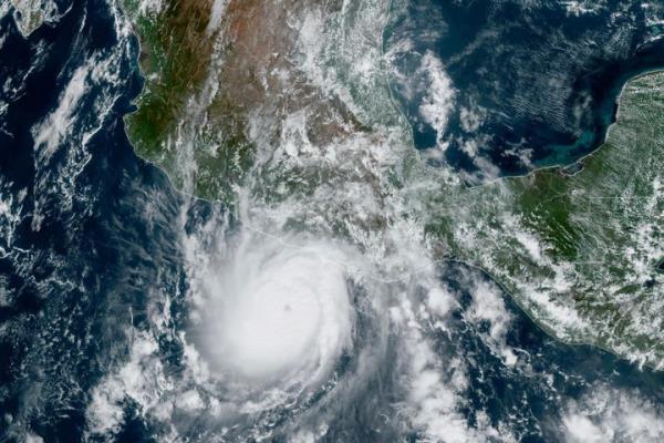 This satellite image provided by NOAA on Tuesday, Oct. 24, 2023, shows Hurricane Otis approaching Mexico's Pacific coast near Acapulco. Otis is forecast to make landfall early Wednesday and there is a hurricane warning in effect from Punta Maldo<em></em>nado to Zihuatanejo. (NOAA via AP)