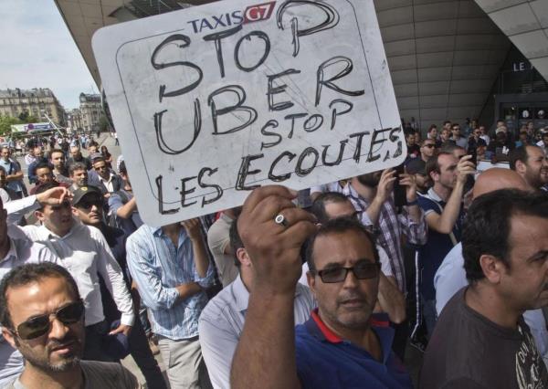 French taxi drivers sue Uber over unfair competition