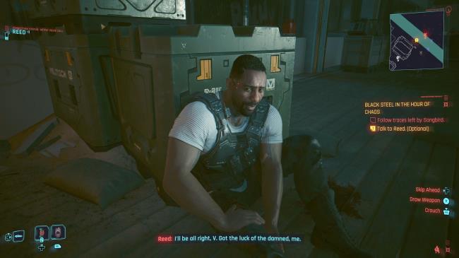 Cyberpunk 2077 Phantom Liberty Screenshot Of Reed Sat Down, Holding His Injured Leg