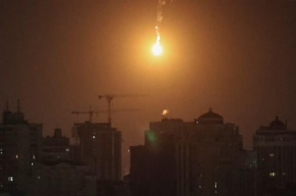 An explosion of a drone is seen in the sky over the city during a Russian drone strike, amid Russia's attack on Ukraine, in Kyiv, Ukraine November 25, 2023. REUTERS/Gleb Garanich