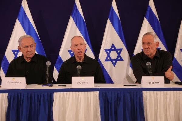 Israeli Prime Minister Benjamin Netanyahu, Defense Minister Yoav Gallant and Cabinet Minister Benny Gantz speak during a news co<em></em>nference in the Kirya military ba<em></em>se in Tel Aviv, Israel on Oct. 28, 2023.