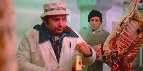 Burt Young looks drunk while Sylvester Stallone looks on in Rocky